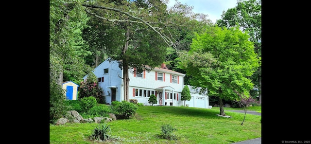 37 Shawnee Rd, Trumbull, CT 06611 - view of front of house with a front lawn and a chimney