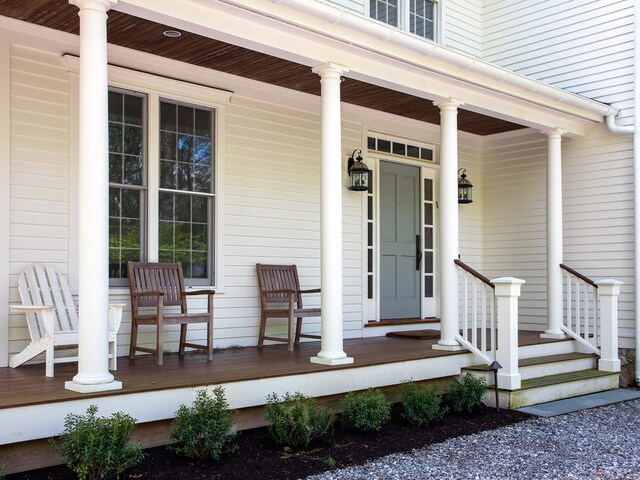 view of exterior entry with covered porch