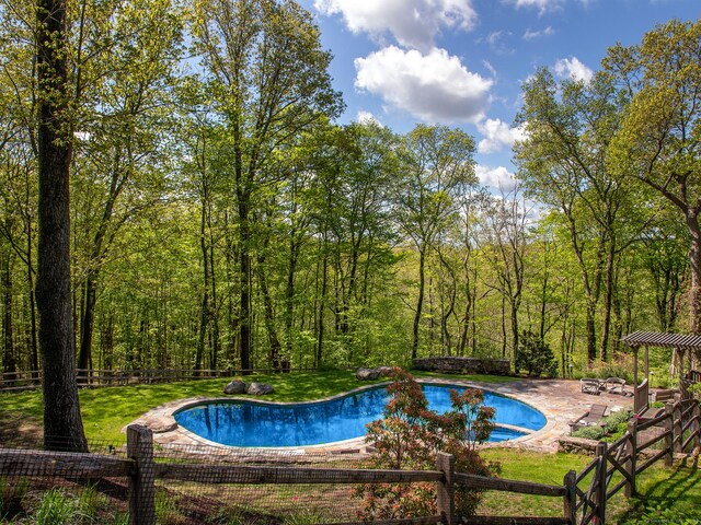 outdoor pool with a patio
