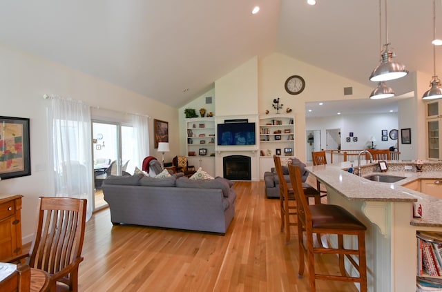 5 Kies Rd, Killingly, CT 06239 - living area featuring high vaulted ceiling, light wood-style floors, and a fireplace