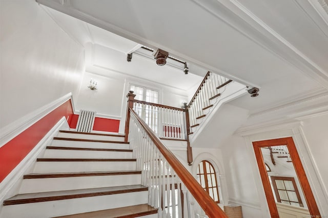 staircase with crown molding