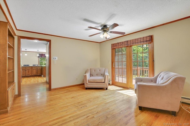 32 Powder Hill Rd, Middlefield, CT 06455 - living area with ornamental molding, light wood-style floors, ceiling fan, a textured ceiling, and baseboards