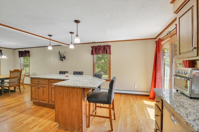 32 Powder Hill Rd, Middlefield, CT 06455 - kitchen featuring baseboard heating, a center island, a textured ceiling, light wood-type flooring, and a breakfast bar area