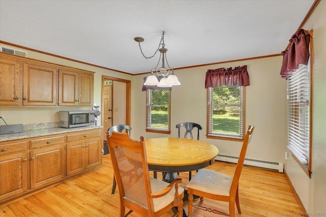 32 Powder Hill Rd, Middlefield, CT 06455 - dining area featuring a baseboard heating unit, light wood-style flooring, ornamental molding, and a chandelier