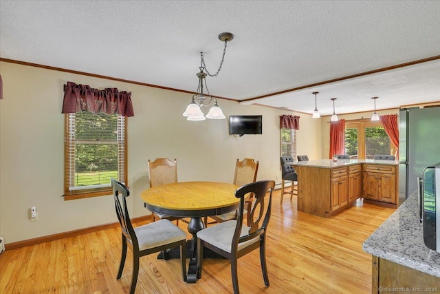32 Powder Hill Rd, Middlefield, CT 06455 - dining space with ornamental molding, a textured ceiling, light wood-style flooring, and baseboards