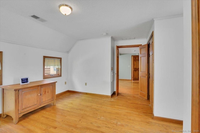 32 Powder Hill Rd, Middlefield, CT 06455 - additional living space with light wood-style floors, vaulted ceiling, a textured ceiling, and baseboards