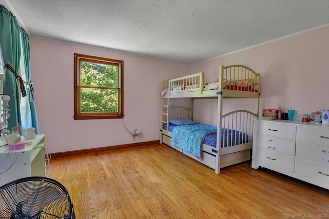 32 Powder Hill Rd, Middlefield, CT 06455 - bedroom featuring light wood-style floors, ornamental molding, a textured ceiling, and baseboards