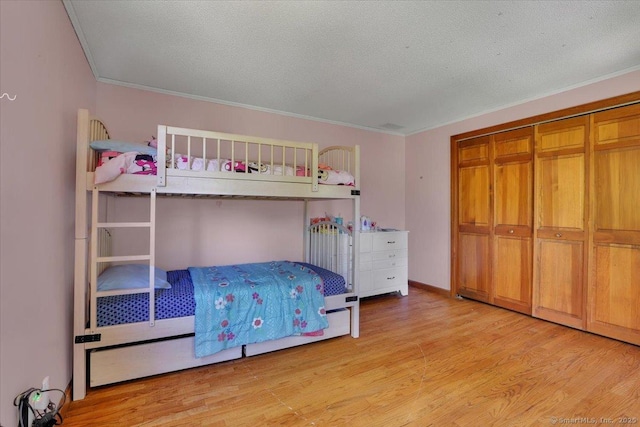 32 Powder Hill Rd, Middlefield, CT 06455 - bedroom featuring light wood finished floors, ornamental molding, a closet, and a textured ceiling