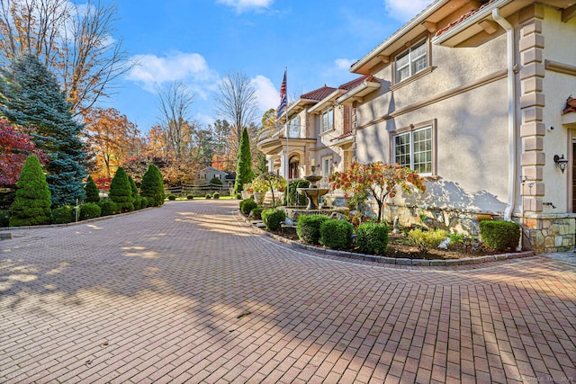 79 Comstock Hill Ave, Norwalk, CT 06850 - view of side of property with stucco siding, a residential view, and a tile roof
