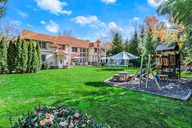 79 Comstock Hill Ave, Norwalk, CT 06850 - view of green lawn featuring a playground and a trampoline