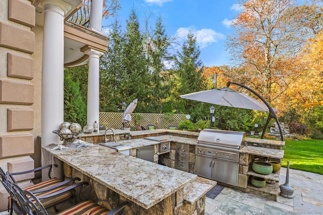 79 Comstock Hill Ave, Norwalk, CT 06850 - view of patio featuring exterior kitchen, grilling area, and fence