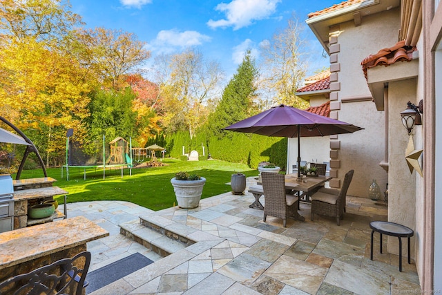 79 Comstock Hill Ave, Norwalk, CT 06850 - view of patio featuring a trampoline, outdoor dining space, and a playground