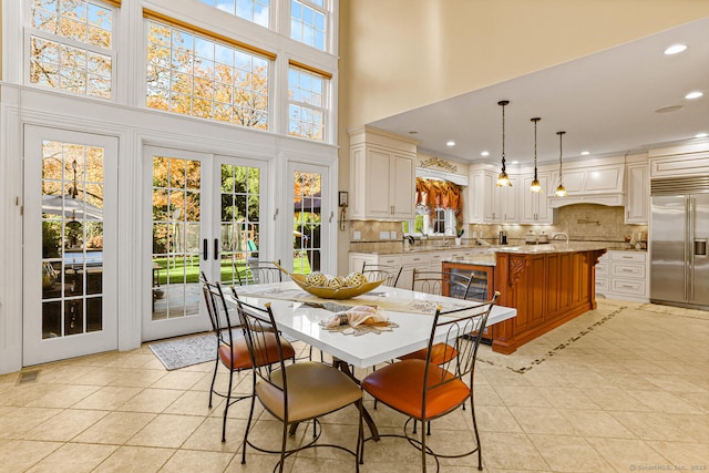 79 Comstock Hill Ave, Norwalk, CT 06850 - dining area with light tile patterned floors, recessed lighting, and a high ceiling