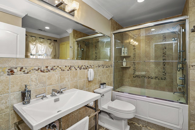 79 Comstock Hill Ave, Norwalk, CT 06850 - bathroom featuring crown molding, a sink, tile walls, enclosed tub / shower combo, and toilet