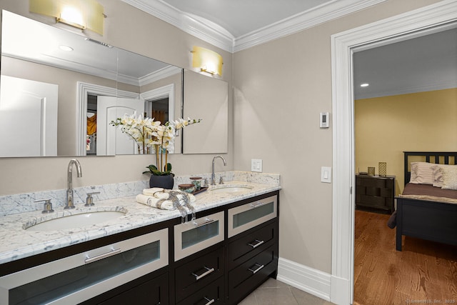 79 Comstock Hill Ave, Norwalk, CT 06850 - full bathroom featuring double vanity, ornamental molding, baseboards, and wood finished floors