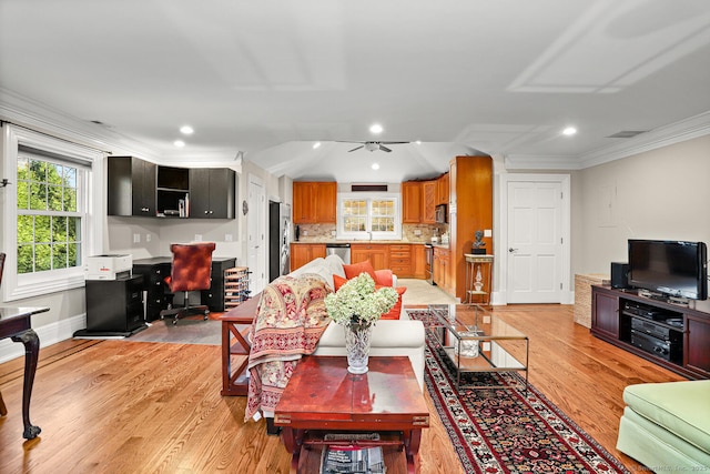79 Comstock Hill Ave, Norwalk, CT 06850 - living room featuring an office area, plenty of natural light, ornamental molding, light wood finished floors, and ceiling fan
