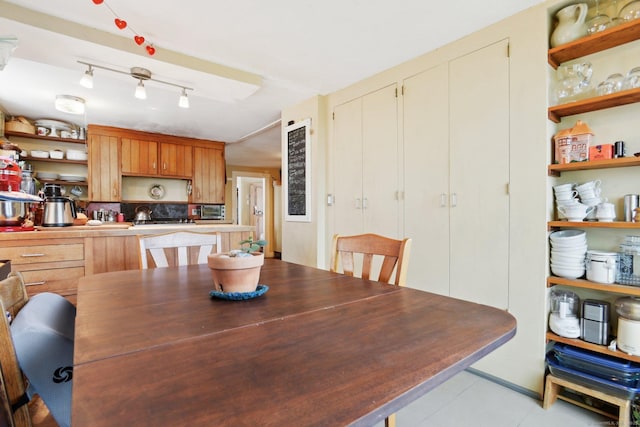 dining space featuring light tile patterned floors