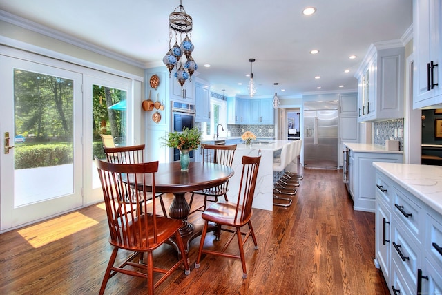 11 Tall Pines Dr, Weston, CT 06833 - dining space with ornamental molding, dark wood-style flooring, and recessed lighting