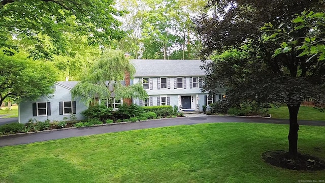 11 Tall Pines Dr, Weston, CT 06833 - view of front of property featuring a front yard, driveway, and a chimney