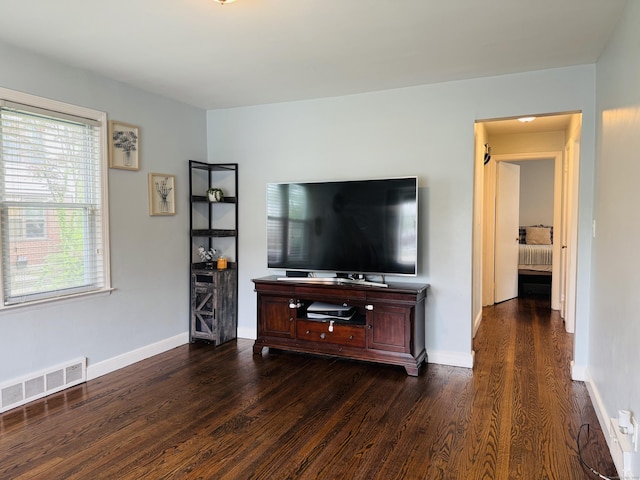 158 Louisiana Ave, Bridgeport, CT 06610 - living area with dark wood-style flooring and baseboards