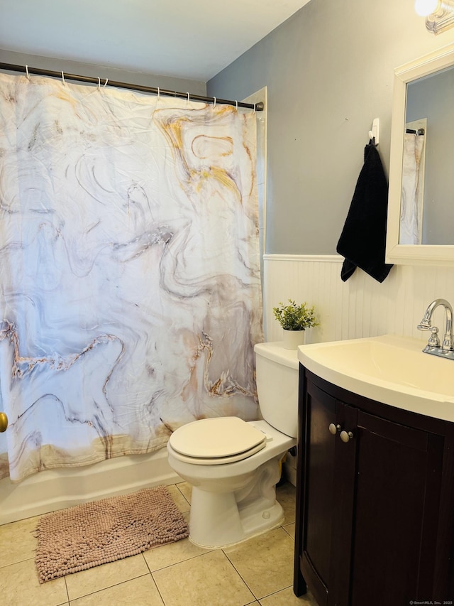 158 Louisiana Ave, Bridgeport, CT 06610 - bathroom with a wainscoted wall, toilet, vanity, and tile patterned floors