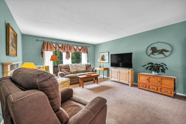 carpeted living area featuring a textured ceiling and baseboards