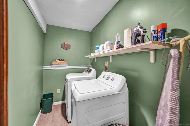 washroom featuring washing machine and clothes dryer, carpet floors, and baseboards
