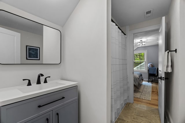 227 Sugar St, Newtown, CT 06470 - full bath with marble finish floors and vanity