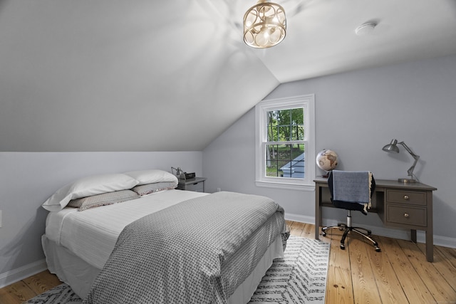 227 Sugar St, Newtown, CT 06470 - bedroom featuring lofted ceiling, light wood finished floors, baseboards, and a desk
