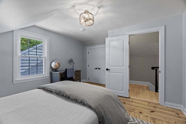 227 Sugar St, Newtown, CT 06470 - bedroom featuring lofted ceiling, light wood-style floors, a closet, and baseboards