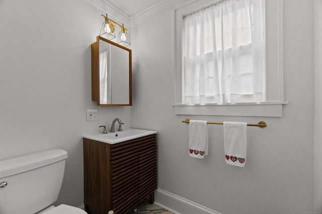 227 Sugar St, Newtown, CT 06470 - half bathroom with ornamental molding, toilet, vanity, and baseboards