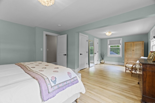 227 Sugar St, Newtown, CT 06470 - bedroom with light wood-style floors and baseboards