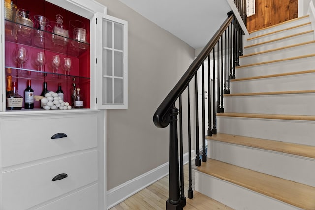 227 Sugar St, Newtown, CT 06470 - staircase featuring baseboards and wood finished floors