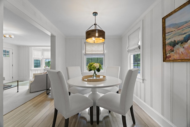 227 Sugar St, Newtown, CT 06470 - dining area featuring a decorative wall, plenty of natural light, and light wood-style floors
