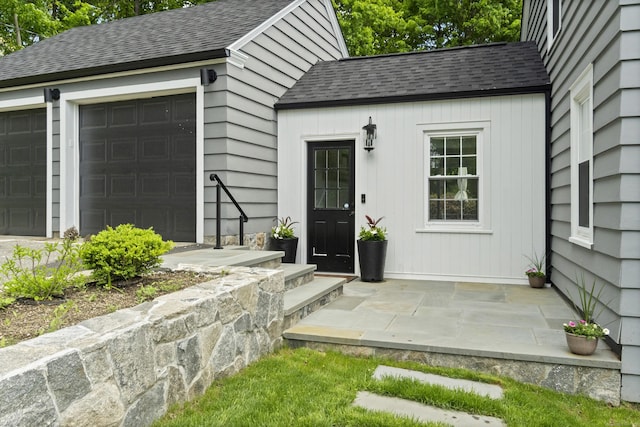 227 Sugar St, Newtown, CT 06470 - property entrance featuring a shingled roof and an attached garage