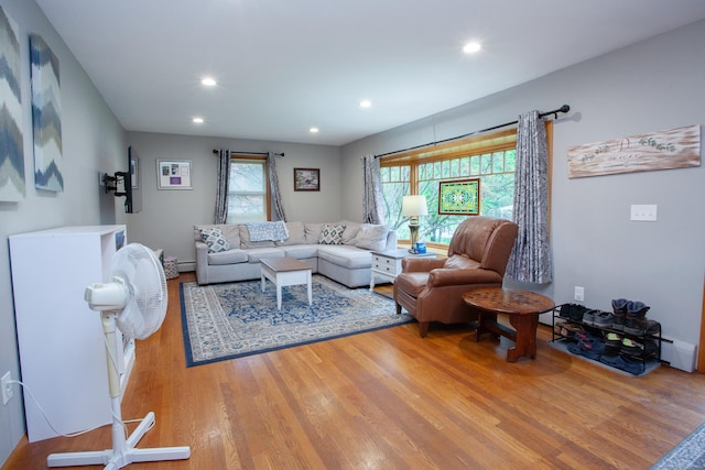 living room with wood finished floors and recessed lighting