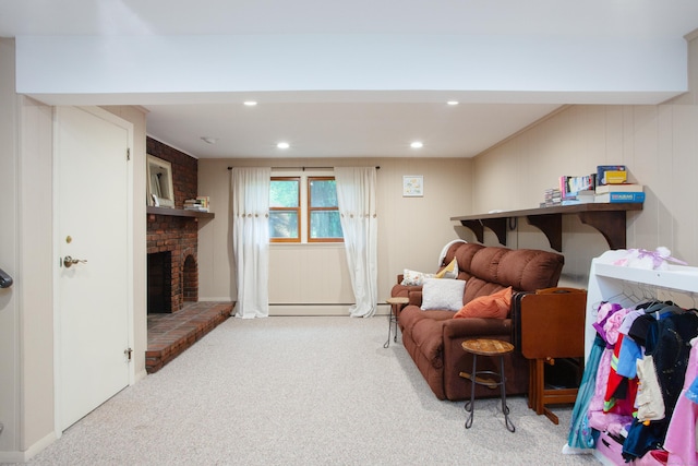 carpeted living room featuring a baseboard heating unit, a brick fireplace, and recessed lighting