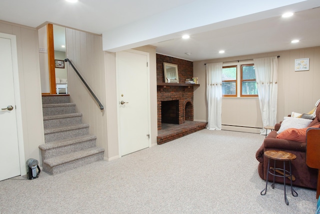 living area featuring carpet, stairs, a fireplace, baseboard heating, and recessed lighting