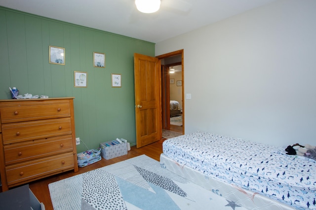 bedroom featuring ceiling fan and wood finished floors