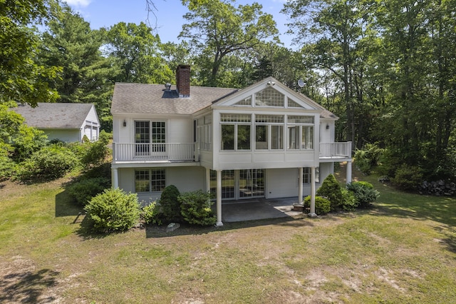 157 Pine Lake Rd, Westbrook, CT 06498 - rear view of property with a patio area, a lawn, a chimney, and roof with shingles