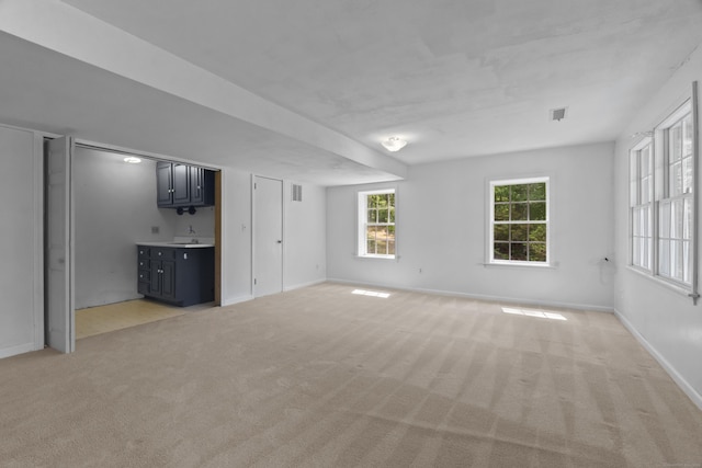 157 Pine Lake Rd, Westbrook, CT 06498 - unfurnished living room with light carpet and baseboards