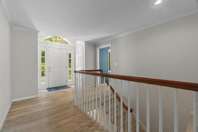 157 Pine Lake Rd, Westbrook, CT 06498 - entryway with wood finished floors and ornamental molding