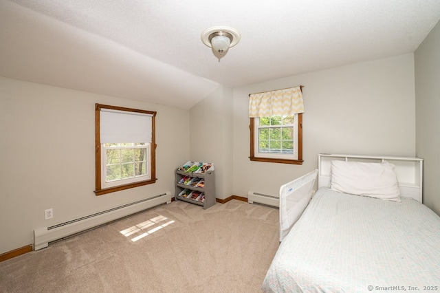 bedroom with a baseboard radiator, baseboard heating, vaulted ceiling, light colored carpet, and baseboards