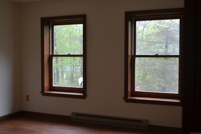 133 Music Vale Rd, Salem, CT 06420 - empty room featuring a baseboard heating unit, healthy amount of natural light, and wood finished floors