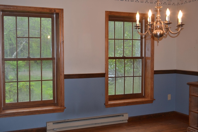 133 Music Vale Rd, Salem, CT 06420 - detailed view of a baseboard radiator, a chandelier, wood finished floors, and baseboards