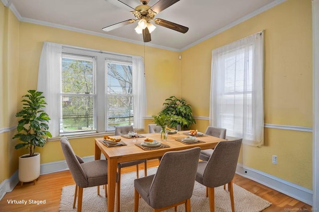 6 Thompson St, Fairfield, CT 06825 - dining area featuring healthy amount of natural light, light wood-type flooring, baseboards, and crown molding