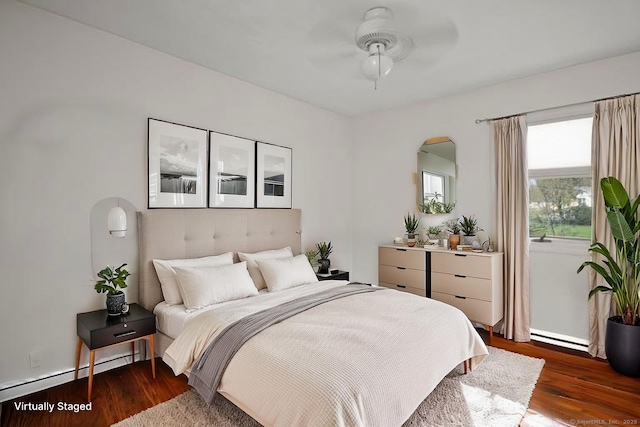 6 Thompson St, Fairfield, CT 06825 - bedroom with dark wood finished floors, a baseboard heating unit, and a ceiling fan