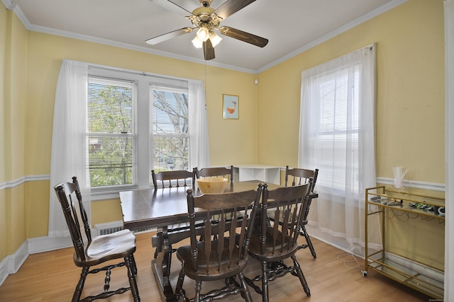 6 Thompson St, Fairfield, CT 06825 - dining room featuring light wood-type flooring, a ceiling fan, ornamental molding, and baseboards