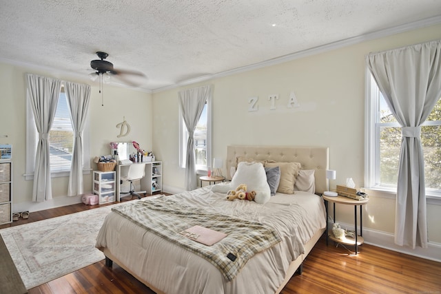 6 Thompson St, Fairfield, CT 06825 - bedroom with a textured ceiling, multiple windows, crown molding, wood finished floors, and a ceiling fan