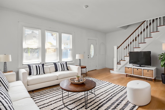 6 Thompson St, Fairfield, CT 06825 - living area with light wood finished floors, stairs, and ornamental molding